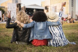 Group of friends watching a concert outdoors