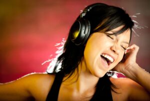 Young Woman Singing with Headphones