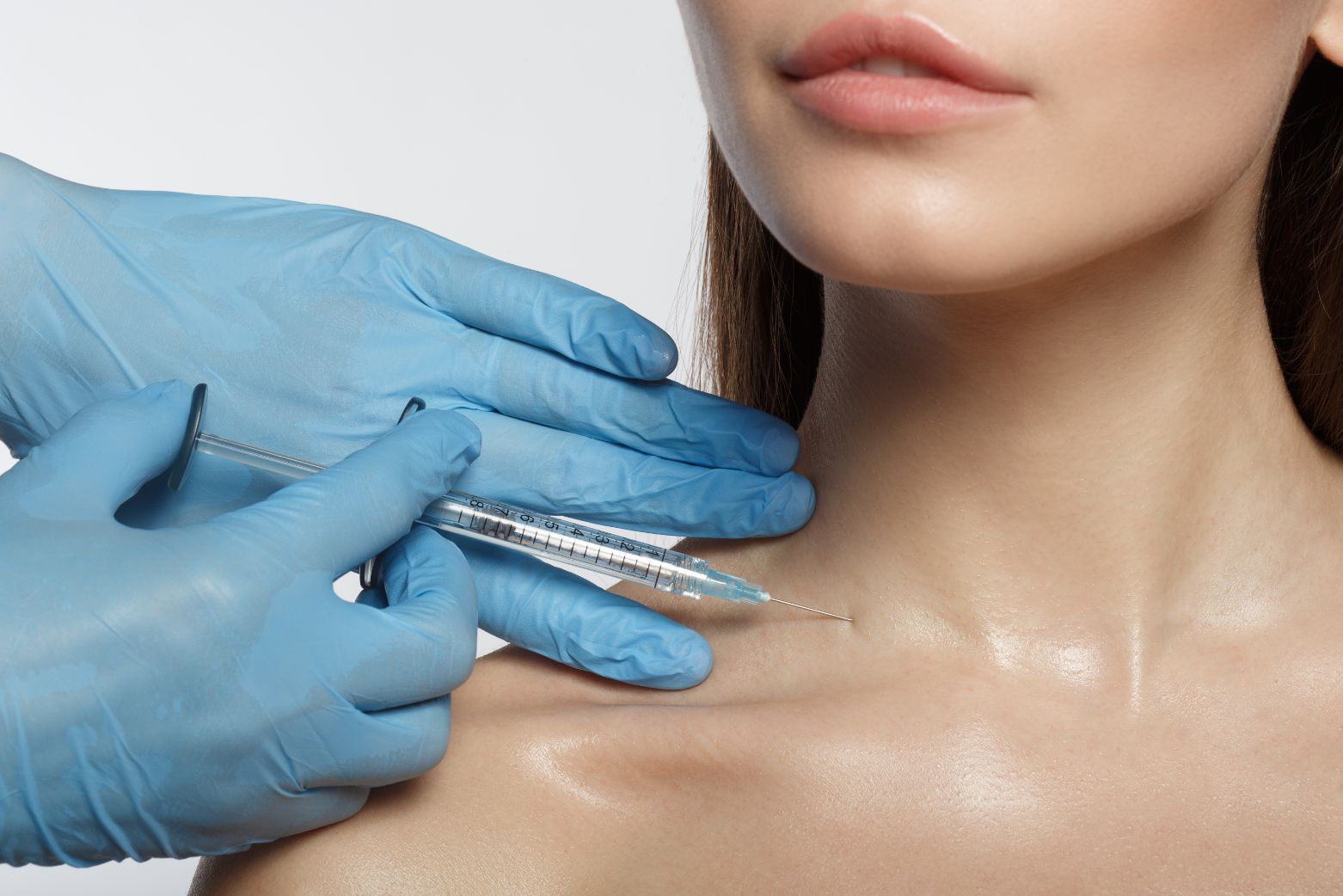 Woman being Injected in base of neck